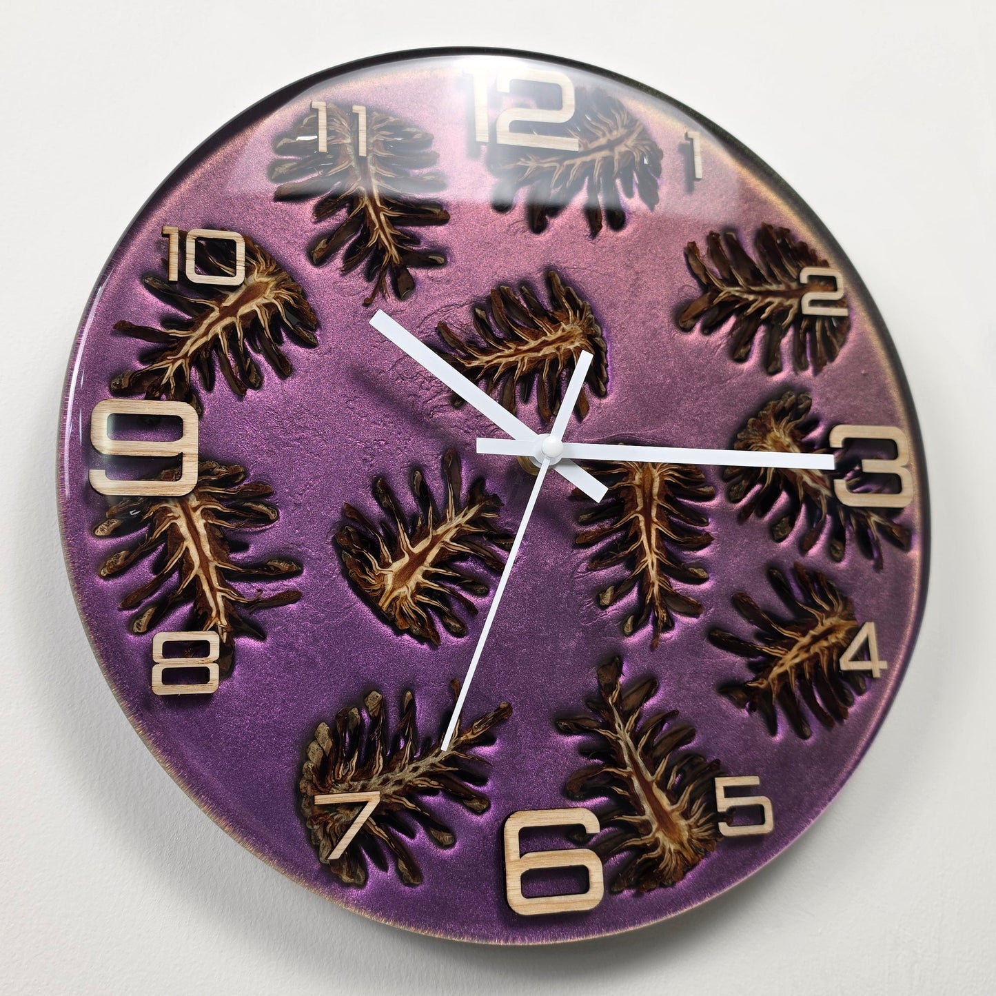 Artistic handmade wall clock inspired by nature with real pine cones and ash wood numerals from the Forest Echoes collection