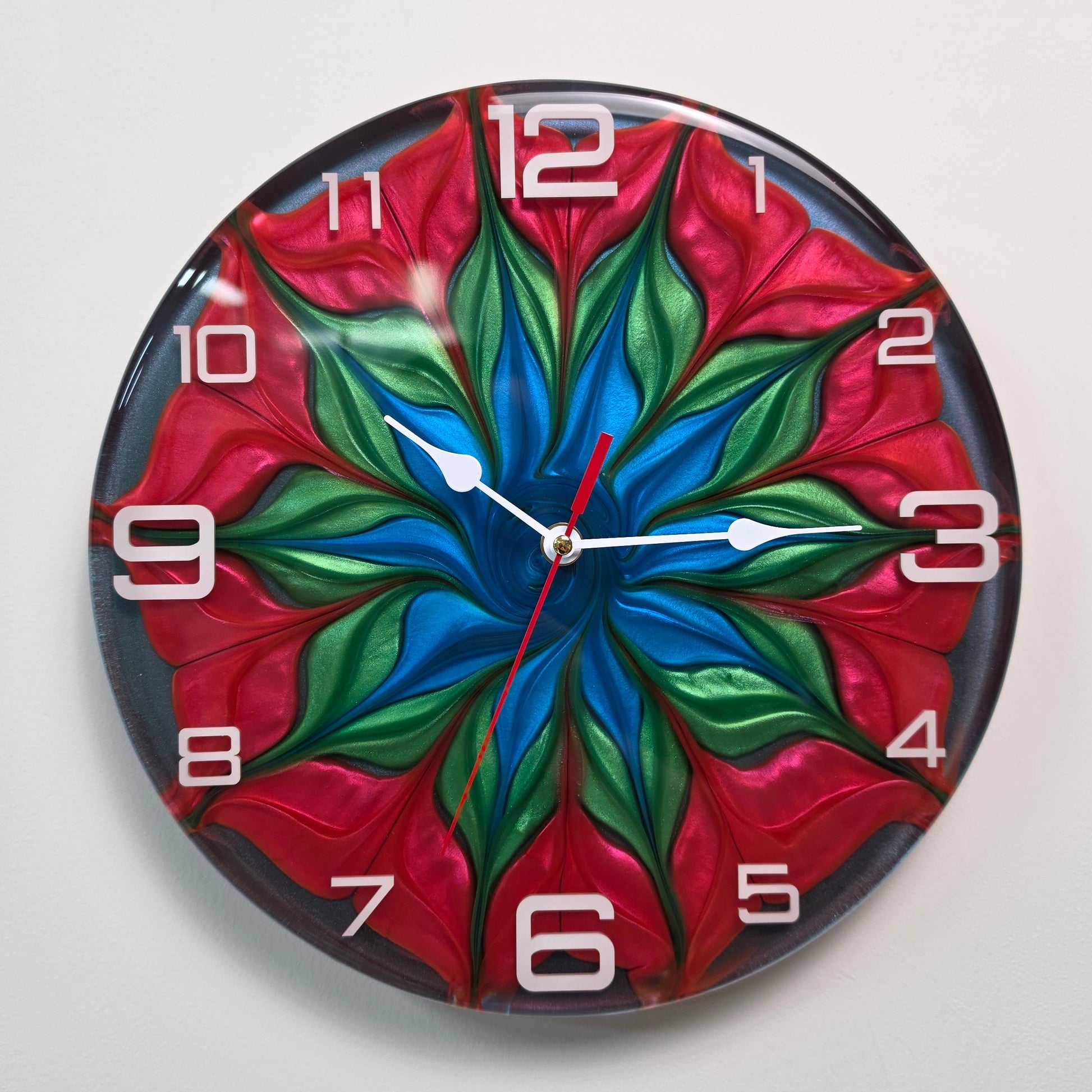 Luxury handmade wall clock with colorful swirling resin pattern, white acrylic numerals and contemporary design