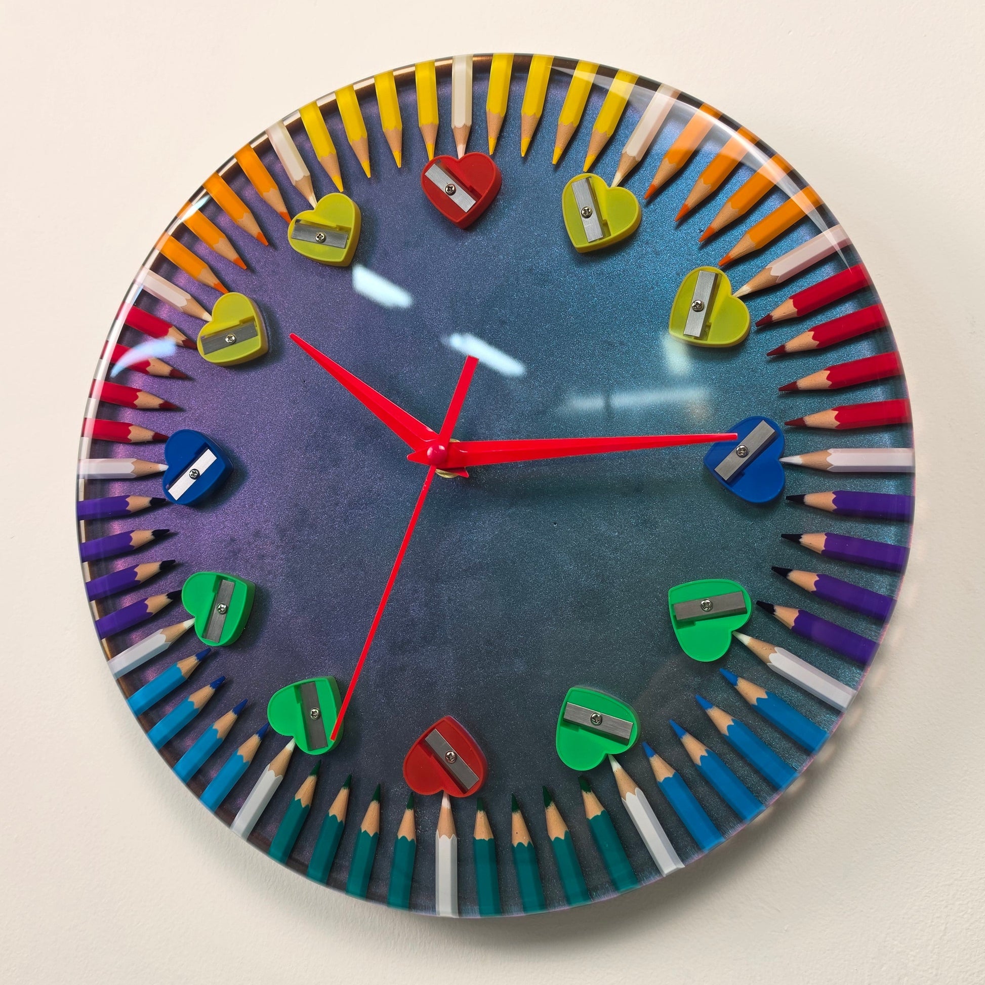 Functional wall art from the Studio Colors collection, handcrafted with colored pencils, heart-shaped sharpeners, and crystal-clear resin.