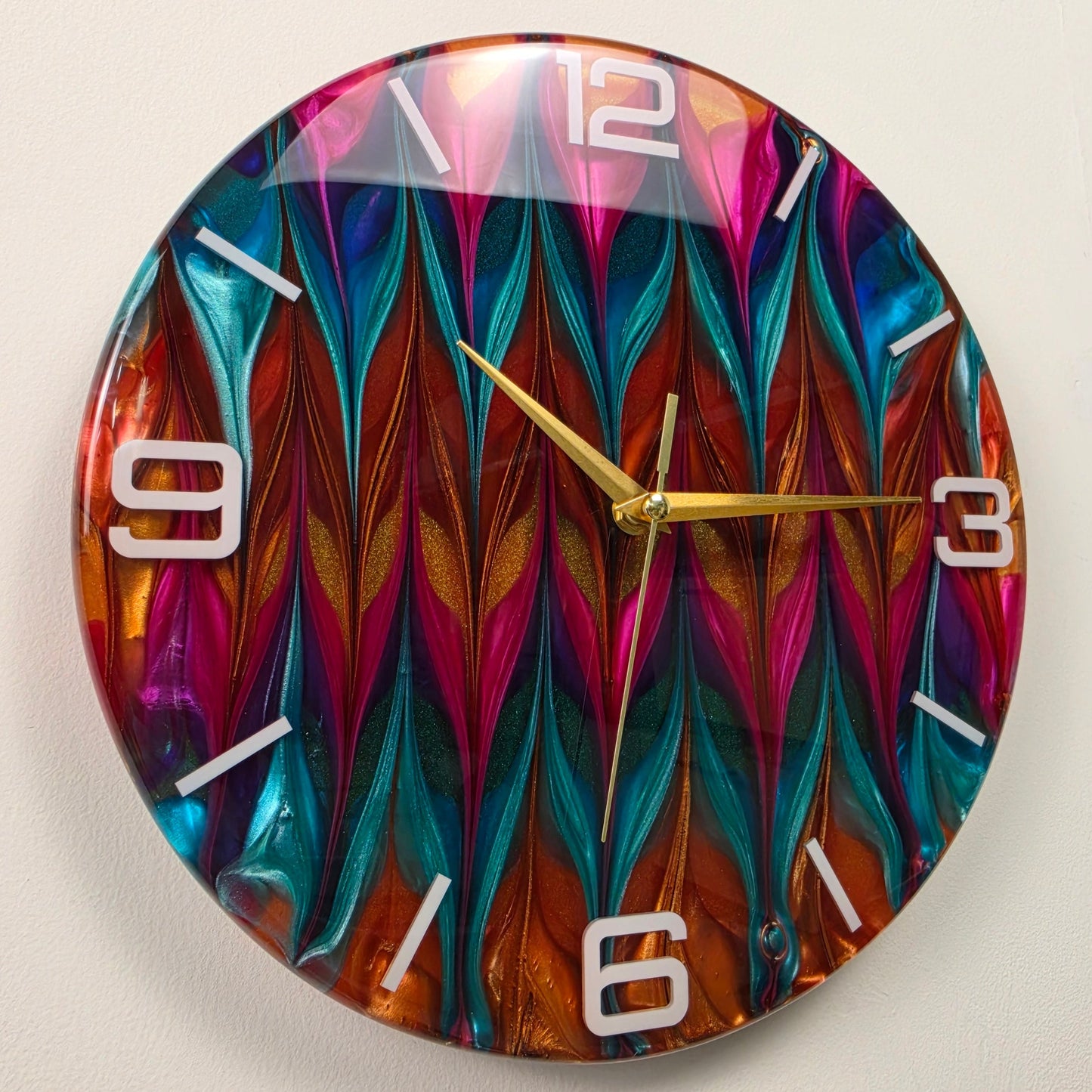 Chromatic Rhythm handmade epoxy resin wall clock with turquoise, magenta and copper-gold abstract patterns.