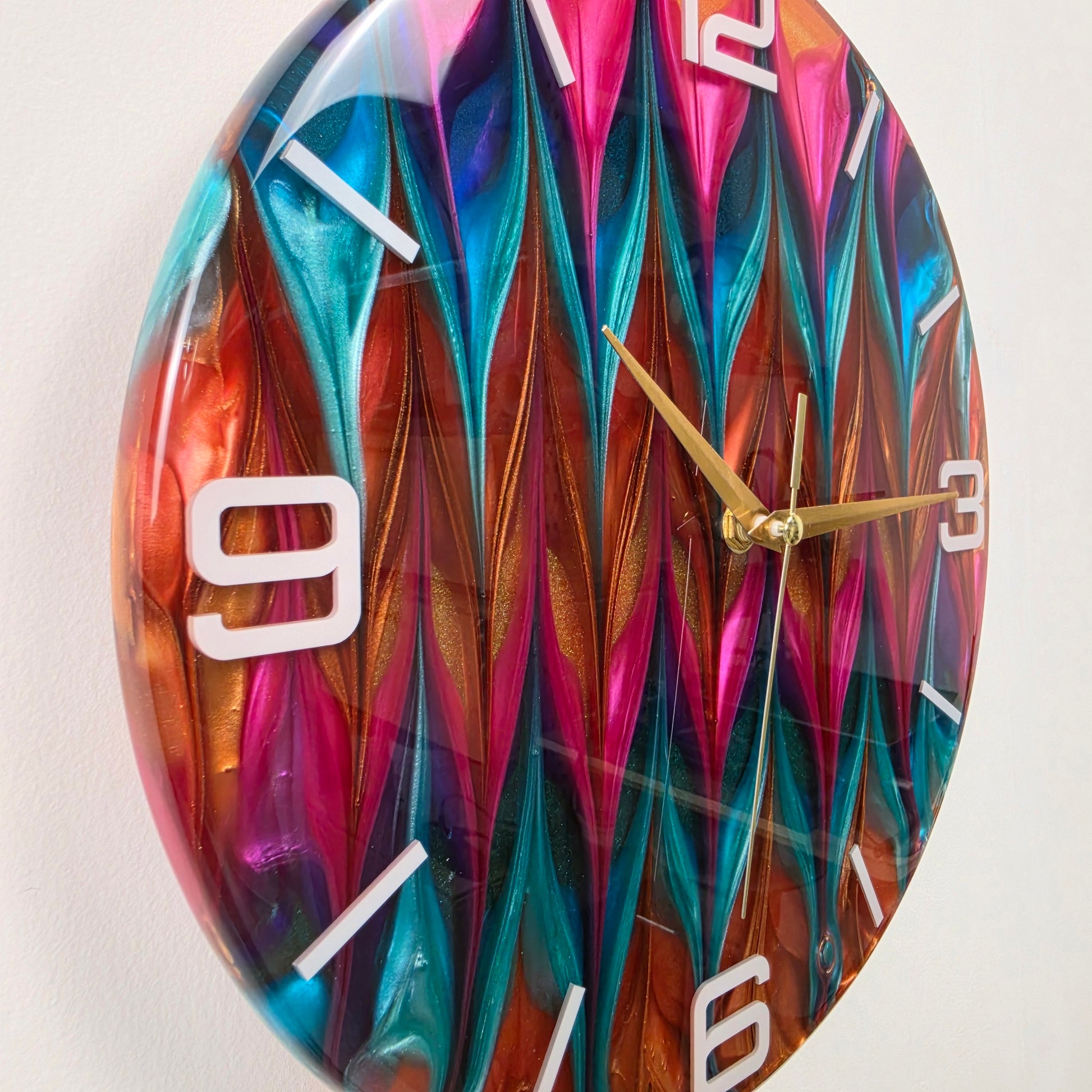 Abstract Time artistic wall clock featuring hand-blended metallic colors and white numbers embedded in clear resin.