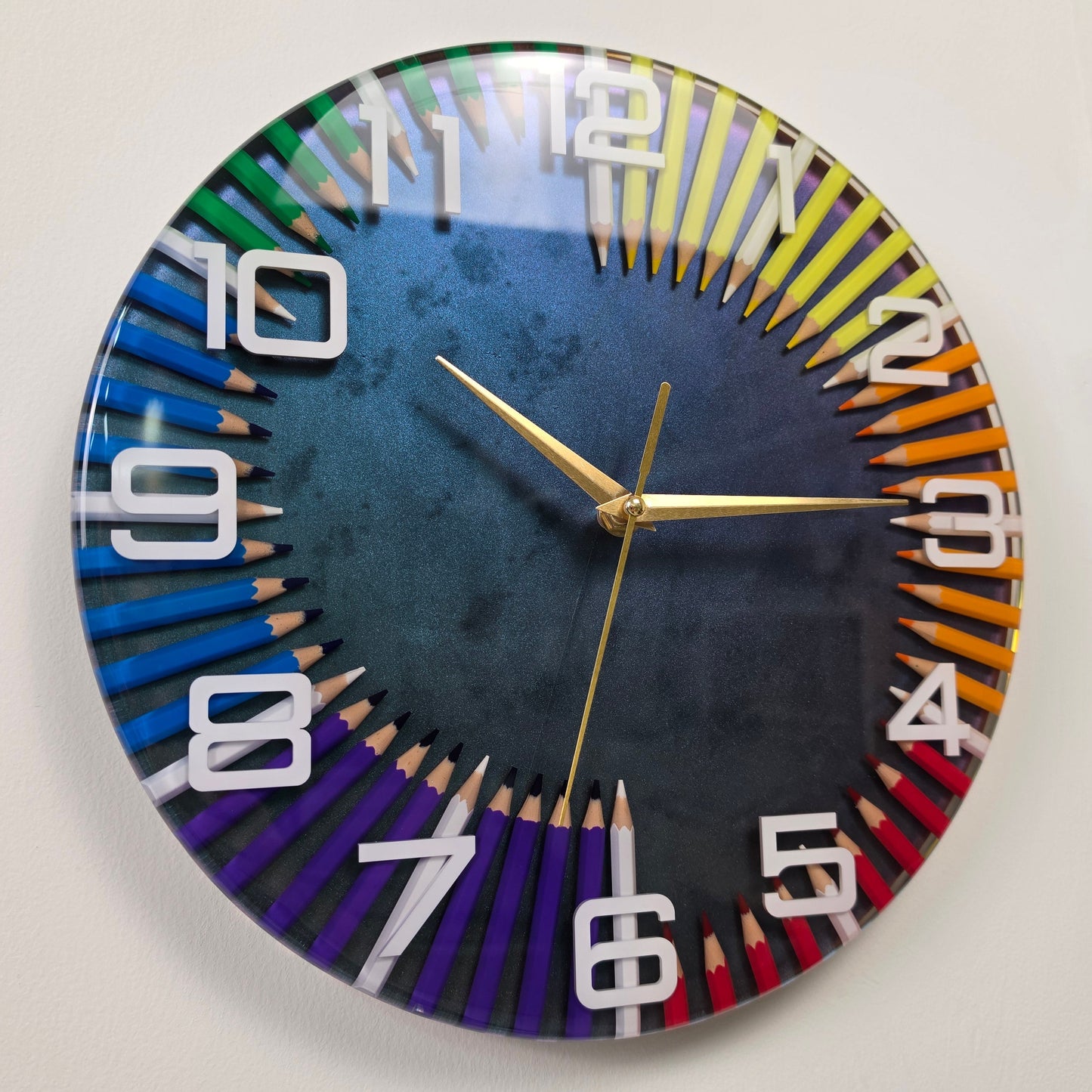 Pencil Spectrum handmade resin wall clock with colorful pencils and white numerals