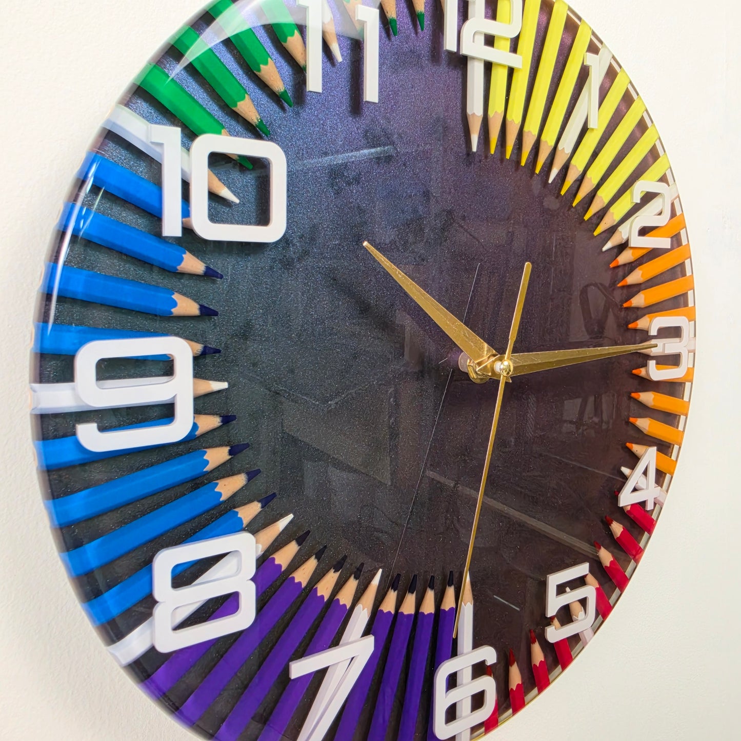 Unique colorful pencil wall clock embedded in clear epoxy resin with gold hands