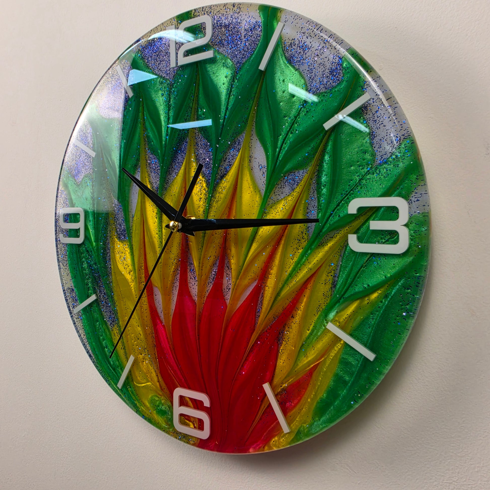 One-of-a-kind decorative resin wall clock with dynamic flowing colors, embedded white acrylic numbers, shimmering blue glitter, and handcrafted Italian craftsmanship.