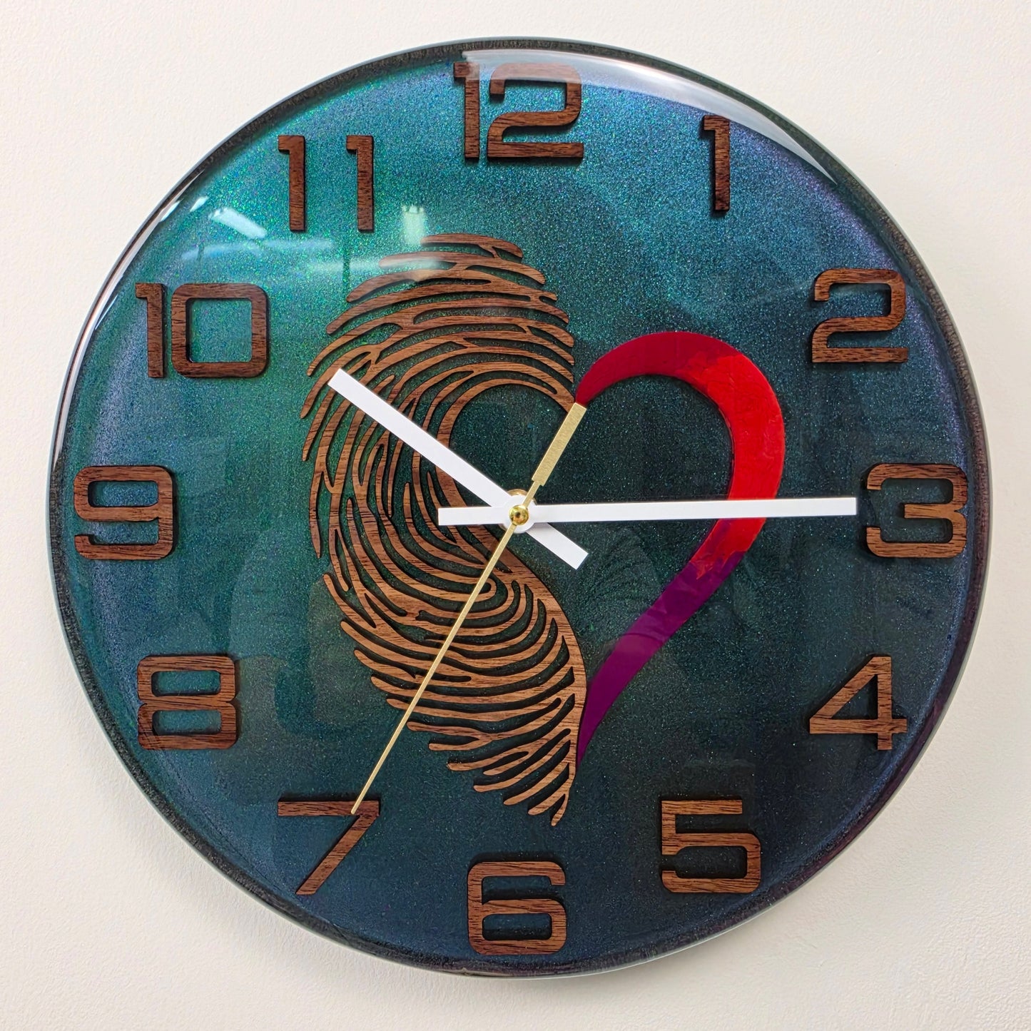 Luxury contemporary resin clock handcrafted in Italy with Black Walnut details and symbolic heart design