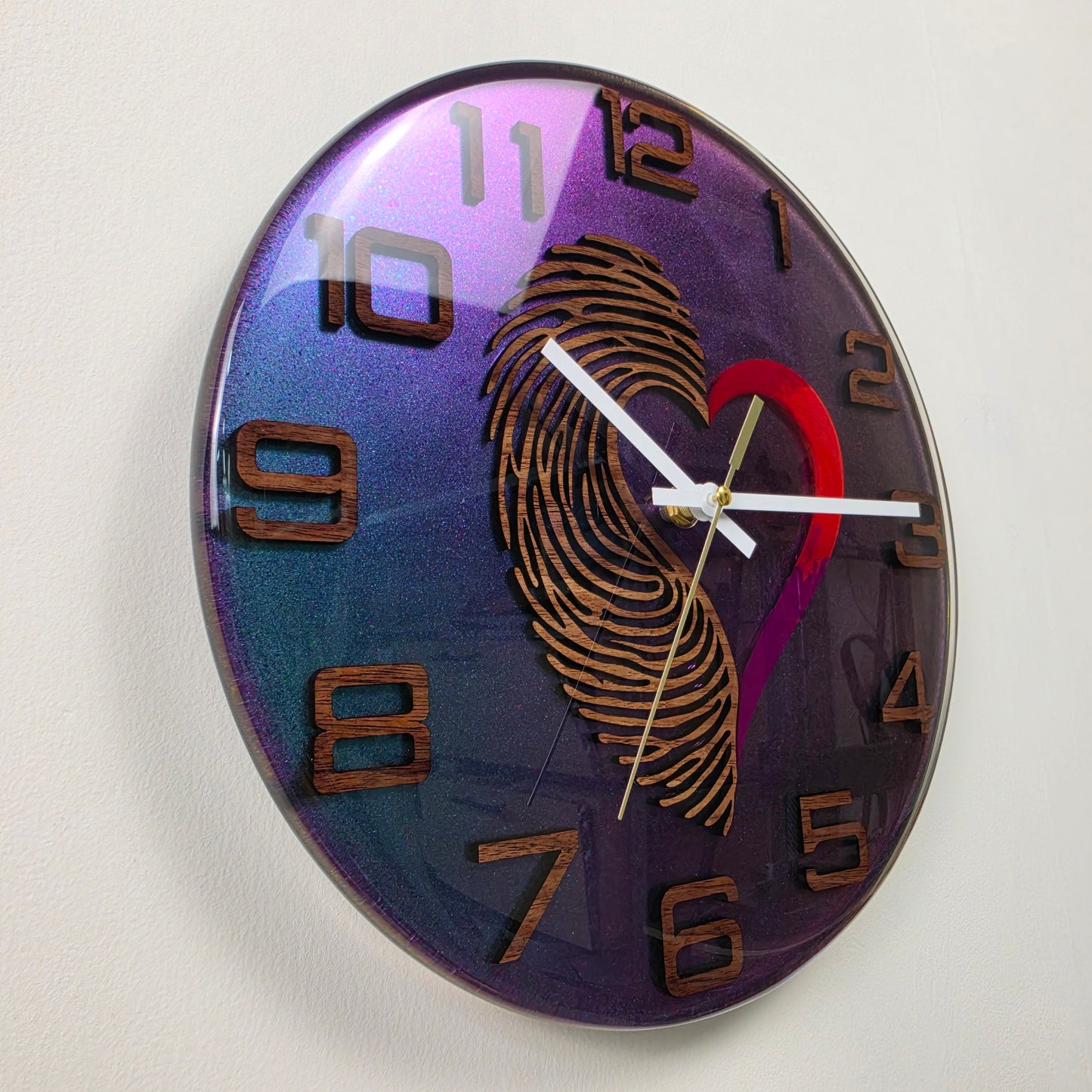 Timeless Symbols Heartprint clock with handcrafted wooden details and iridescent resin background