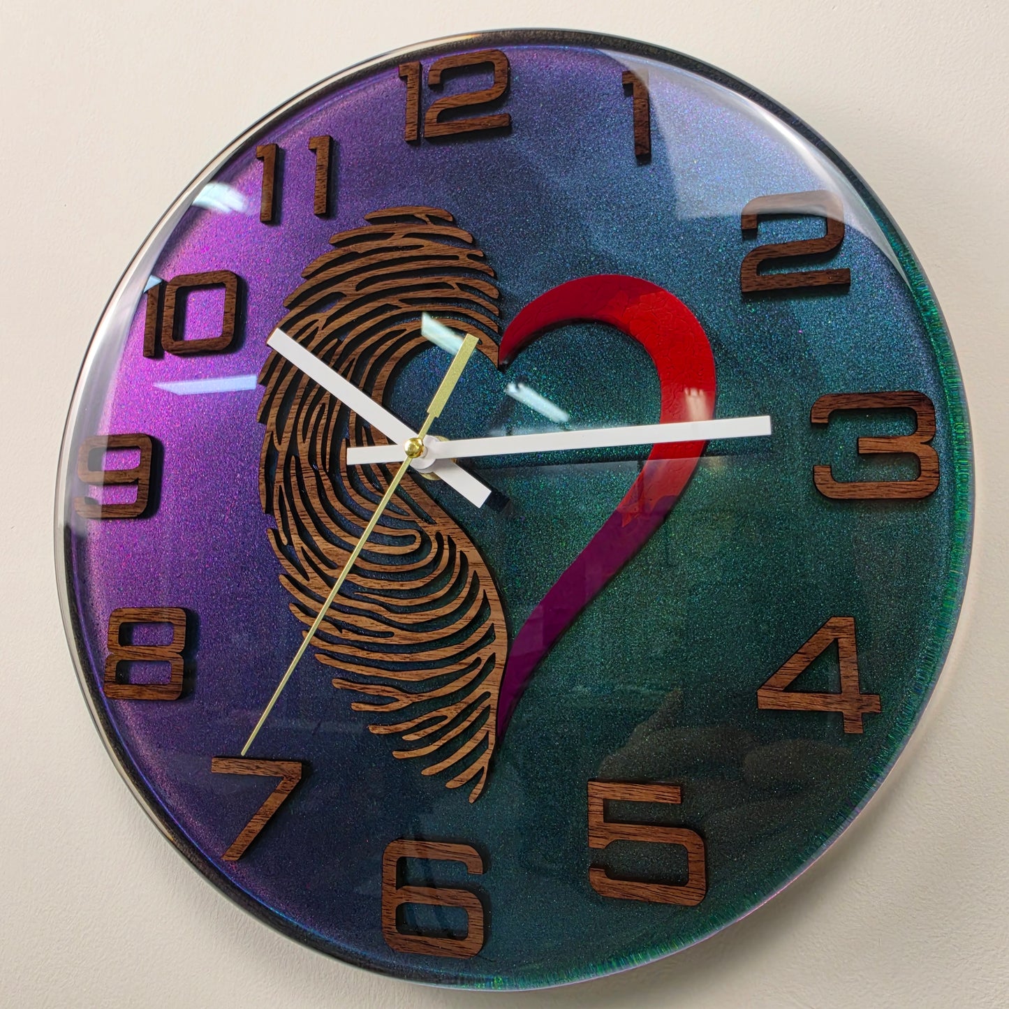 One-of-a-kind handmade wall art clock with fingerprint heart motif, walnut wood and shimmering resin
