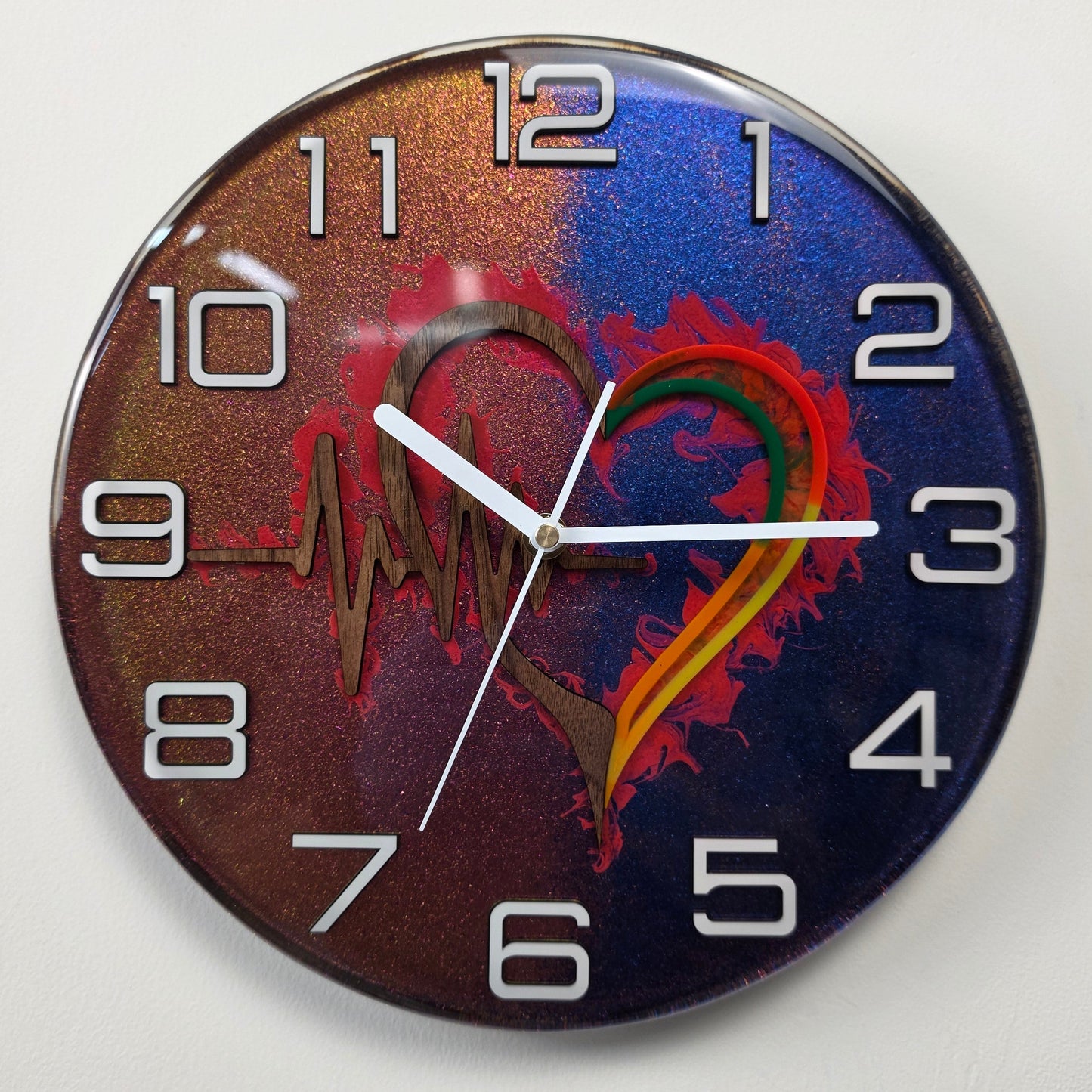 Timeless Symbols resin art clock with wooden heart, ECG heartbeat motif and modern plexiglass numerals.