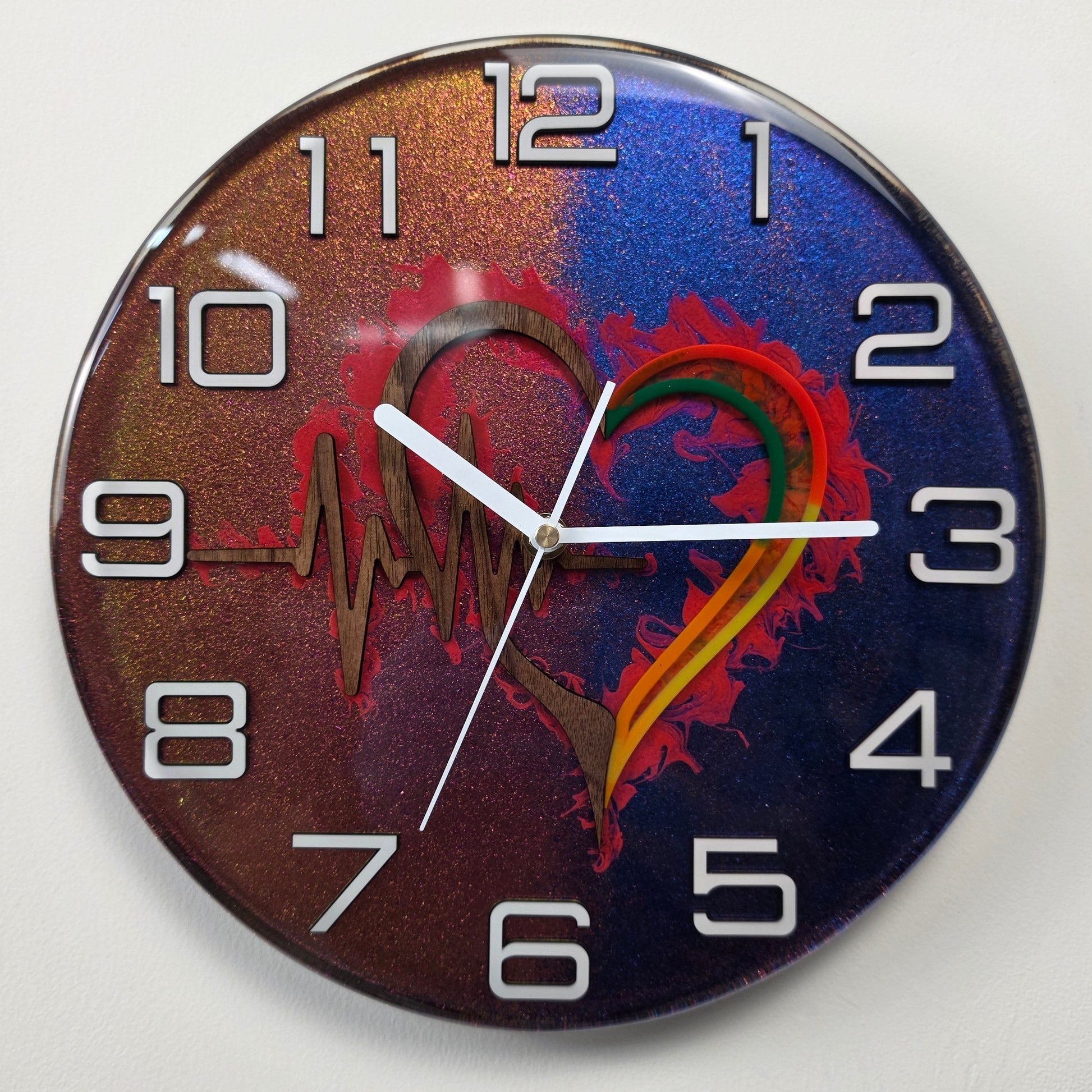 Timeless Symbols resin art clock with wooden heart, ECG heartbeat motif and modern plexiglass numerals.