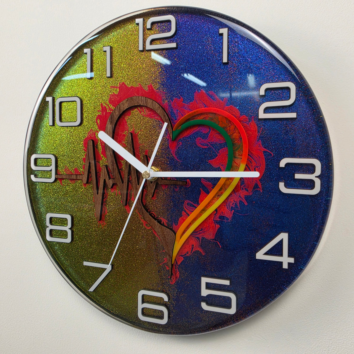 One-of-a-kind functional art clock featuring a wooden ECG heart, chameleon resin effect and white plexiglass numbers.