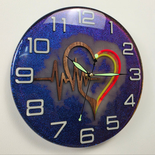 Timeless Symbols Pulse of Life handmade wall clock with Black Walnut heart, ECG line and chameleon resin background.