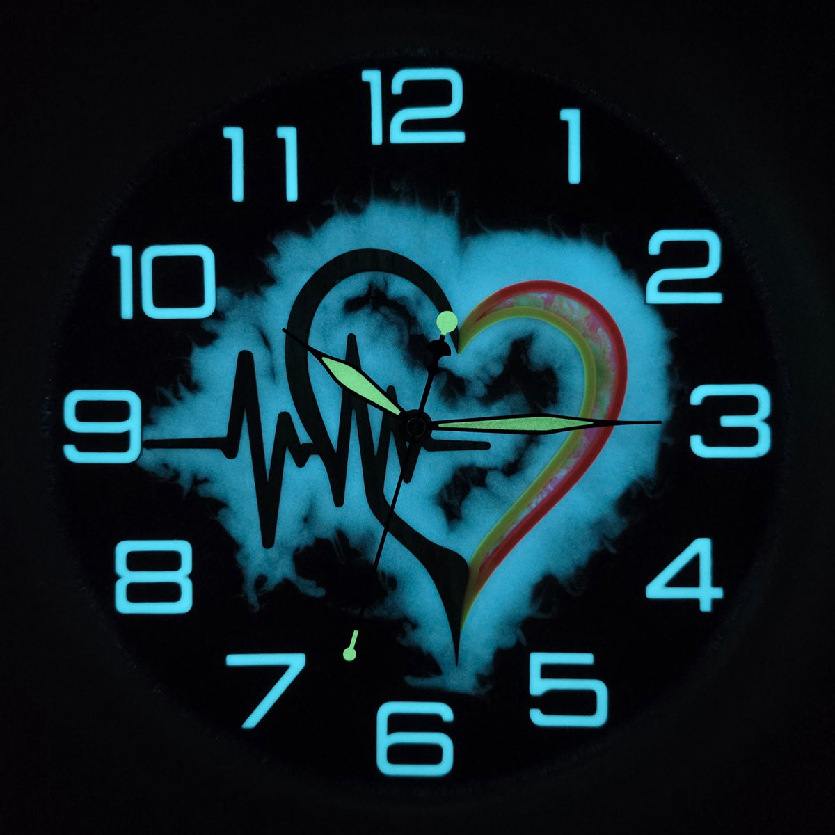 Pulse of Life wall clock glowing in darkness with bright blue numerals and luminous ECG heart composition.