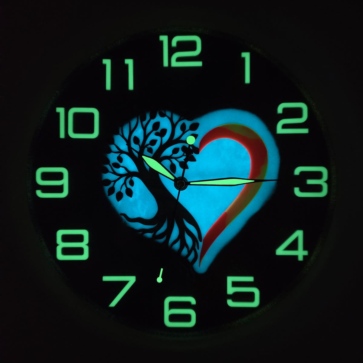 Handmade Italian wall clock featuring Black Walnut wood, Tree of Life heart design and fluorescent glow effect.
