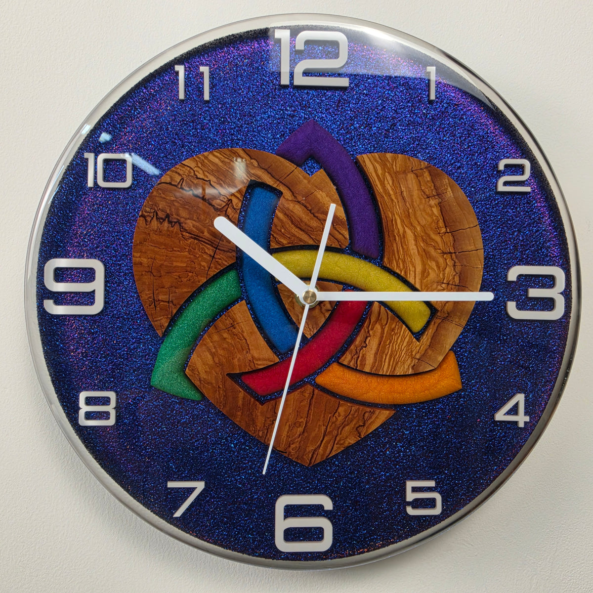 Woven Heart handmade Italian wall clock with white numerals encapsulated in high-gloss transparent resin.