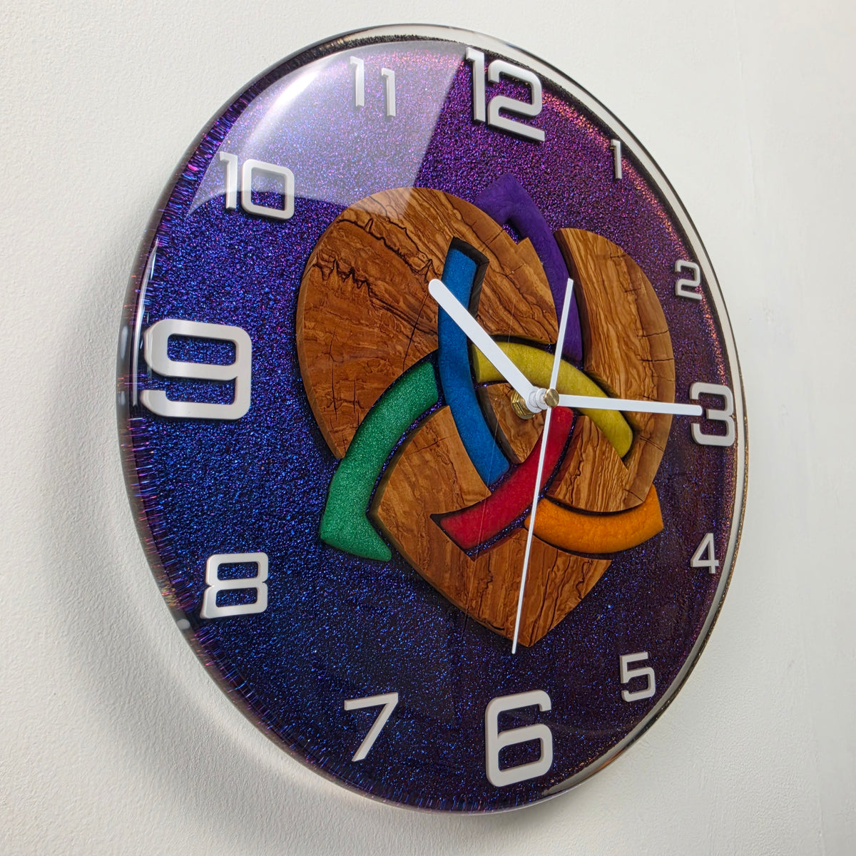 Unique 30 cm wood and resin wall clock with olive wood heart design and white Plexiglas numerals.