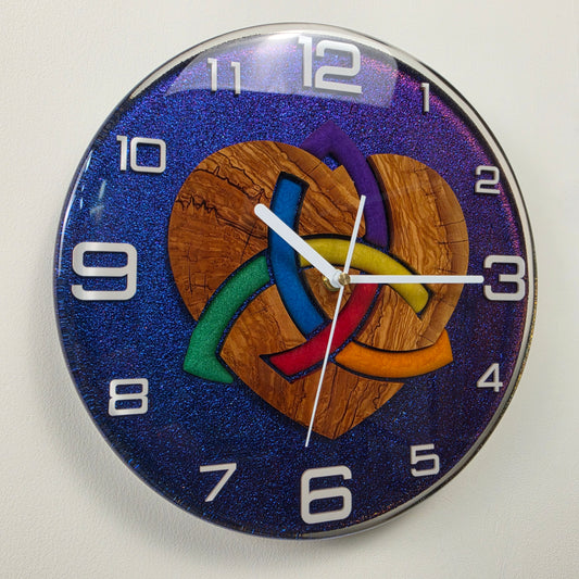 Timeless Symbols Woven Heart wall clock with olive wood, colorful interwoven heart and chameleon resin background.