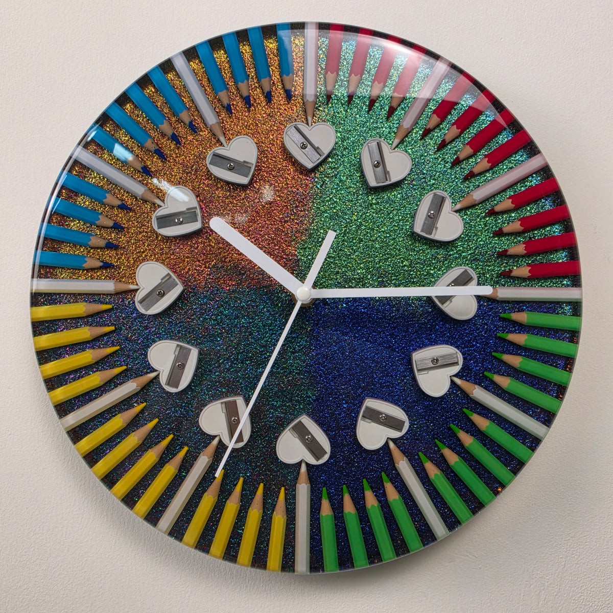 Handmade Four Seasons wall clock with colorful pencils, heart-shaped pencil sharpeners, chameleon pigment and clear epoxy resin.