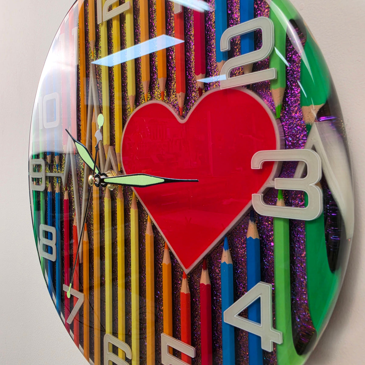 Studio Colors resin art clock with colorful pencils, heartbeat line and color-shifting chameleon background.