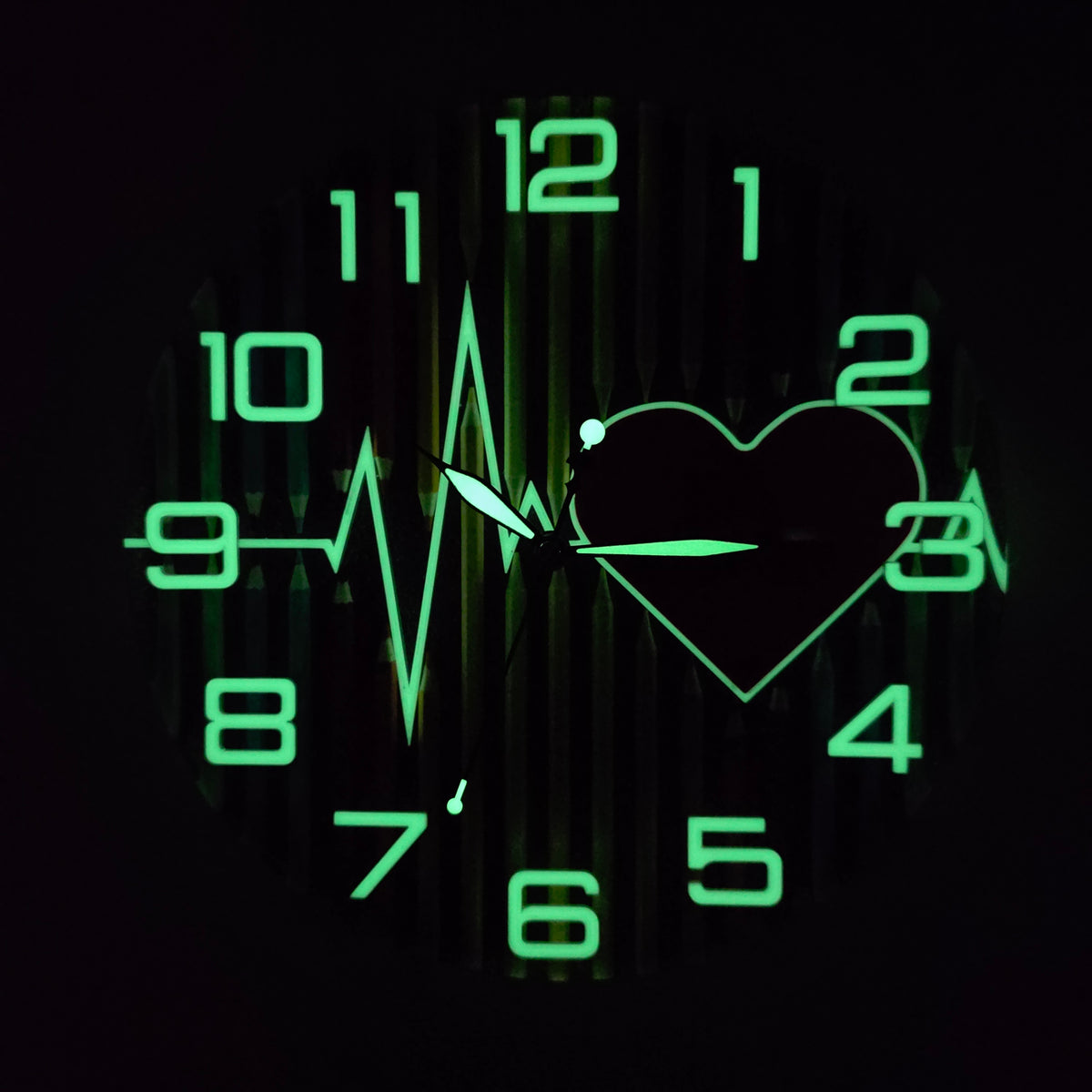 Pulse of Imagination V3 glowing at night with luminous green numbers, clock hands and ECG heart design.