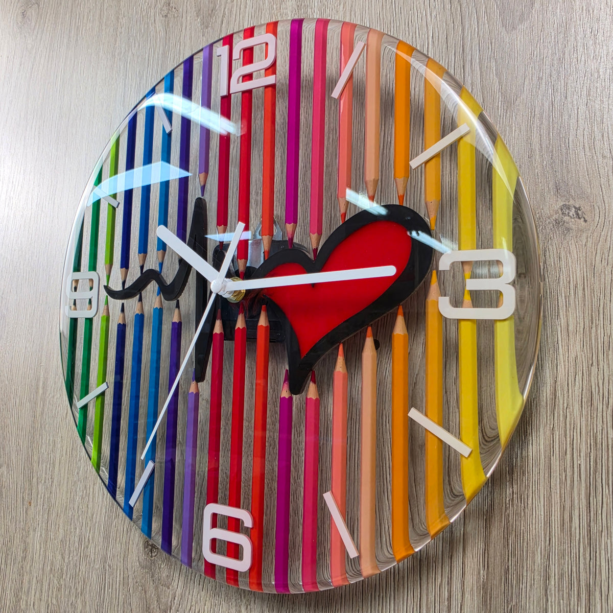 Unique transparent wall clock with colorful pencils, heartbeat line and white clock hands