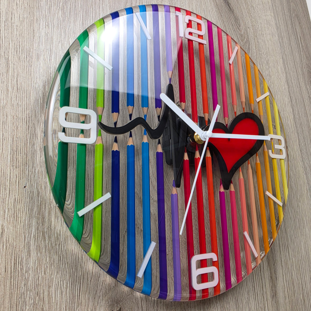 One-of-a-kind 30 cm wall clock with real colored pencils encapsulated in clear epoxy resin