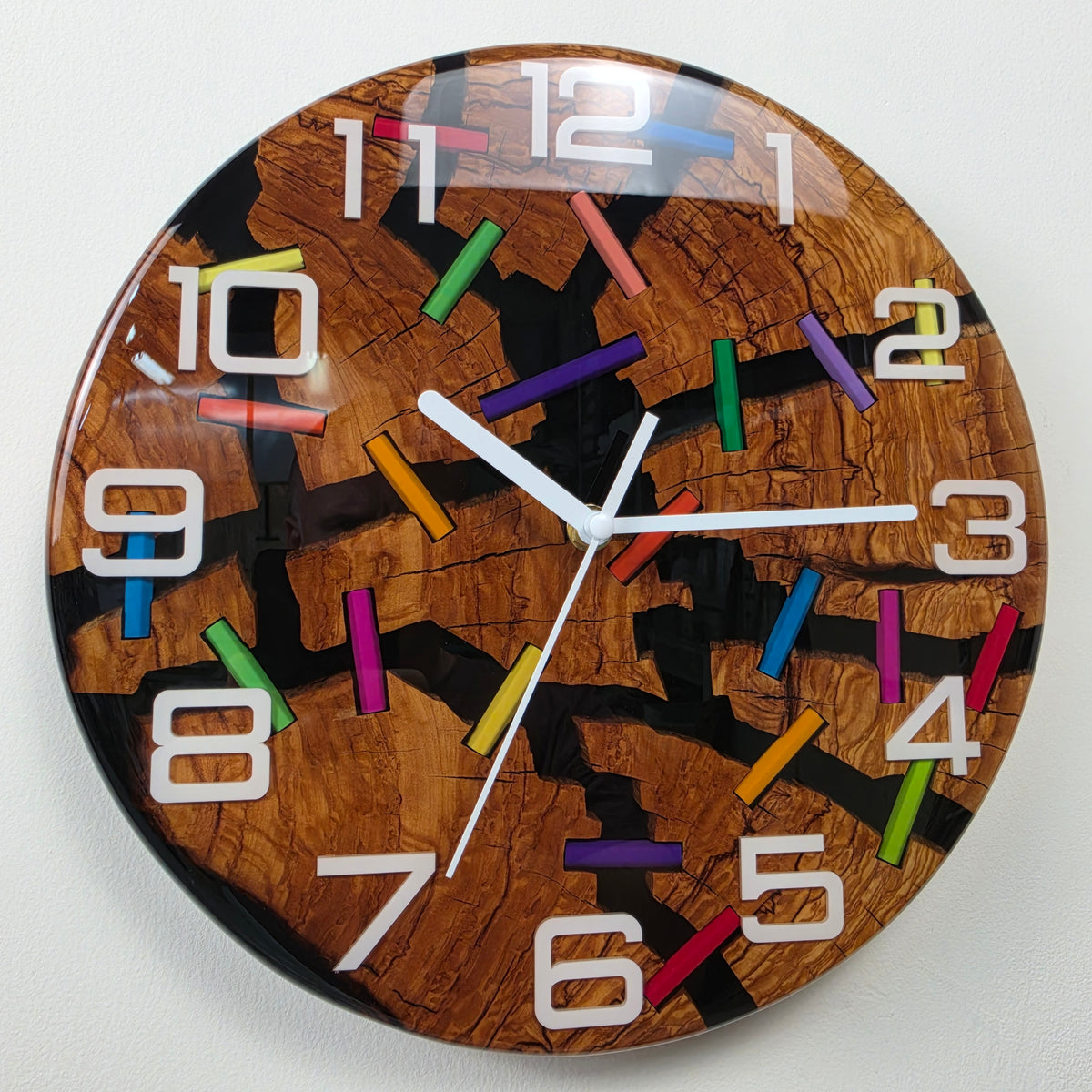 Wood Line Broken Colors handmade wall clock with cracked olive wood, colorful pencil fragments and black epoxy resin.