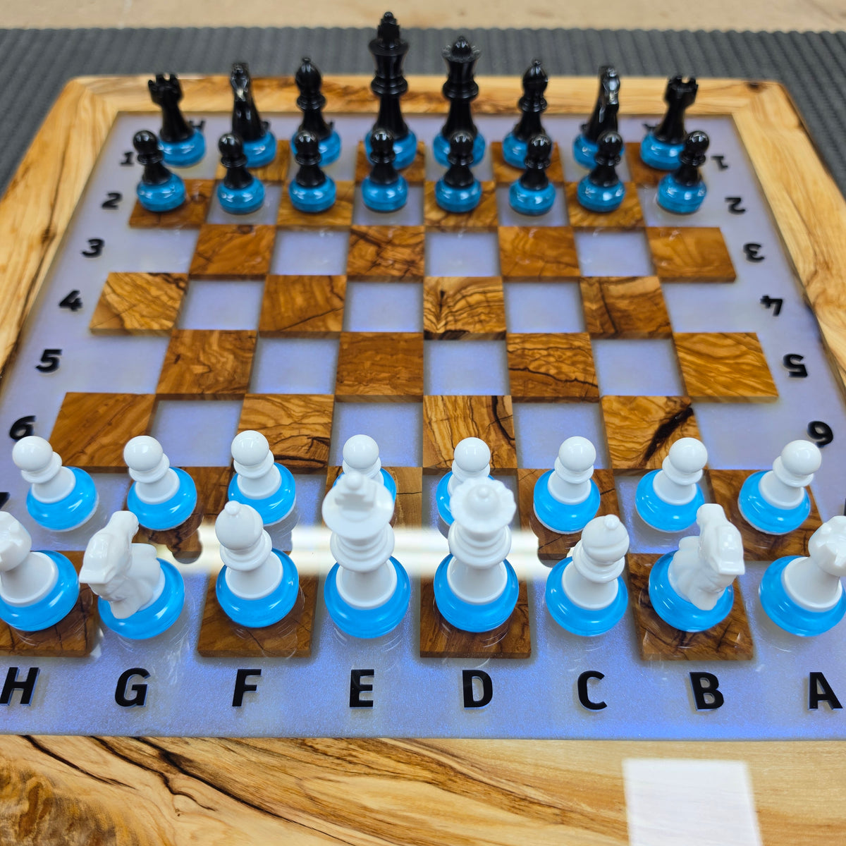 Handmade olive wood and epoxy resin chessboard with integrated LED lighting
