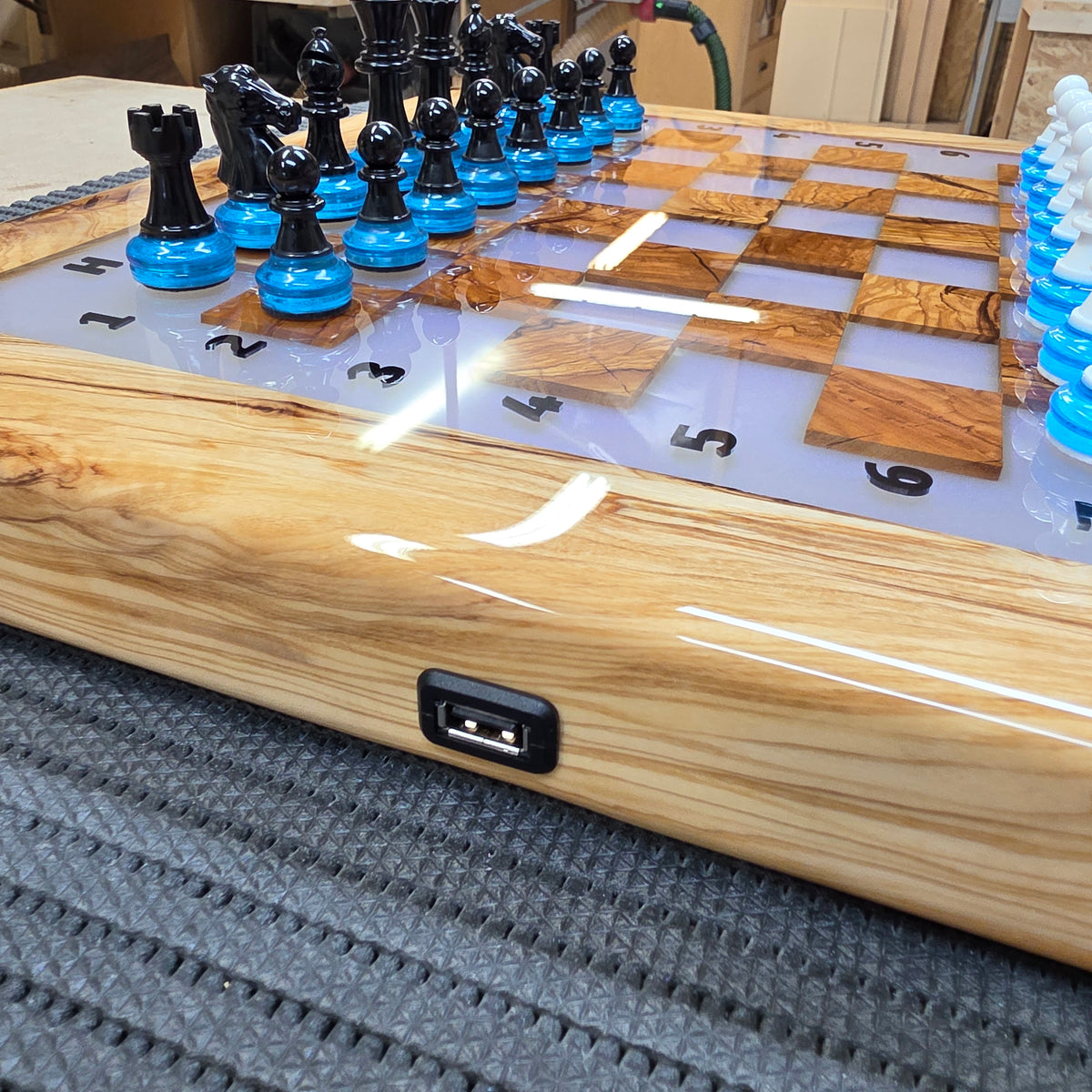 Handcrafted wooden chess set with color changing LED lights and resin finish