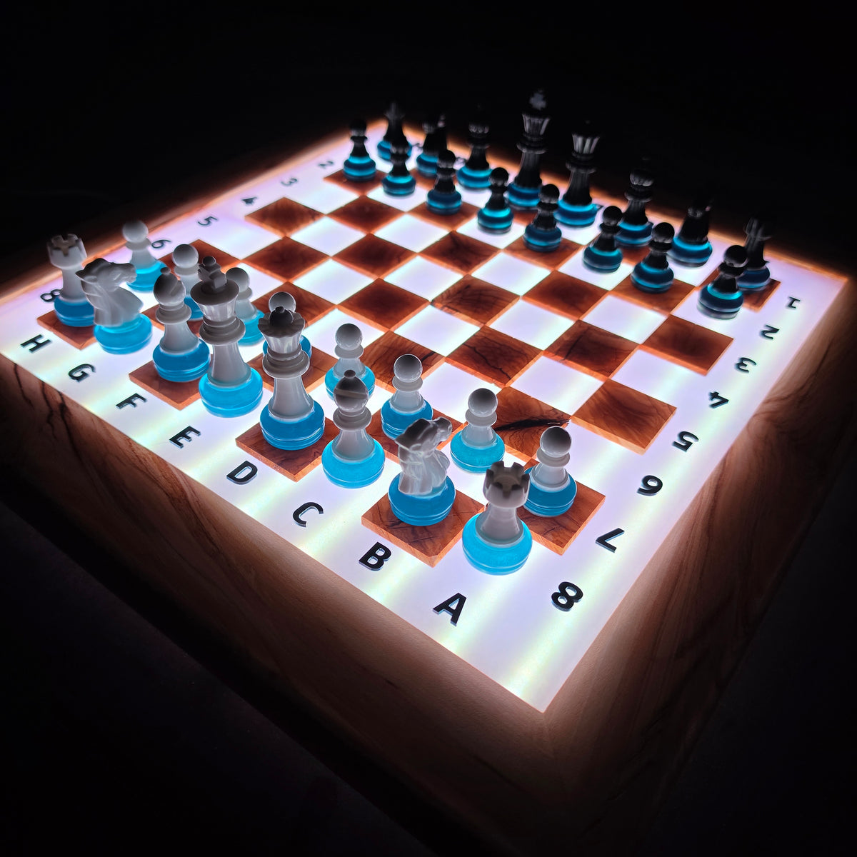 Handmade illuminated chessboard with remote controlled multicolor LED system
