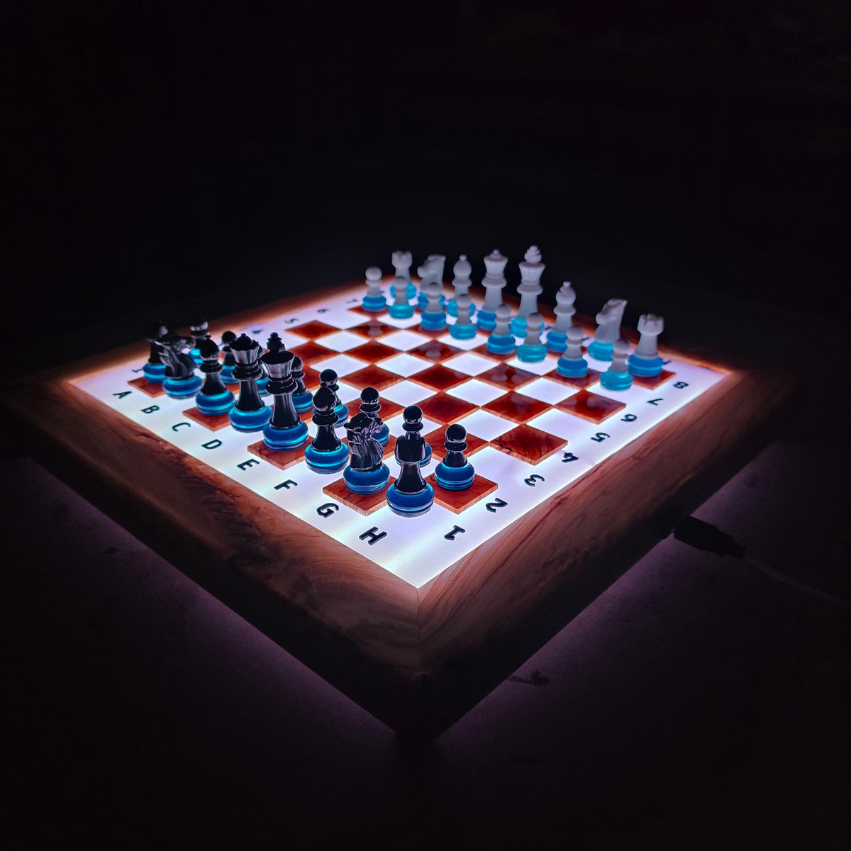 Olive wood and epoxy chessboard glowing in the dark with LED illumination