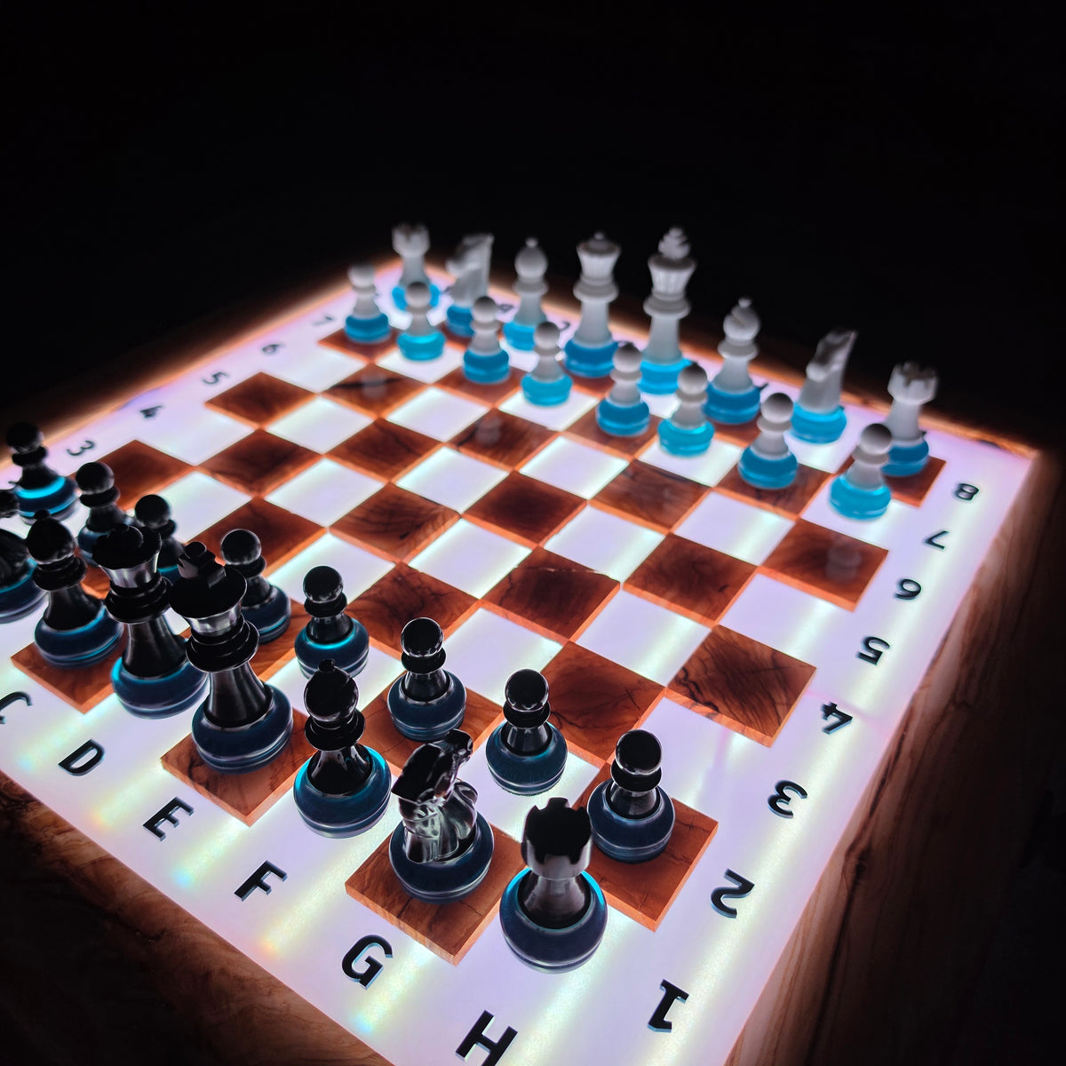 Decorative luxury chess set crafted from olive wood and transparent epoxy resin