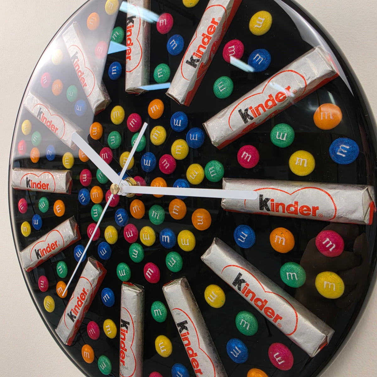 Close-up of Sweet Time handmade wall clock with colorful resin candy details