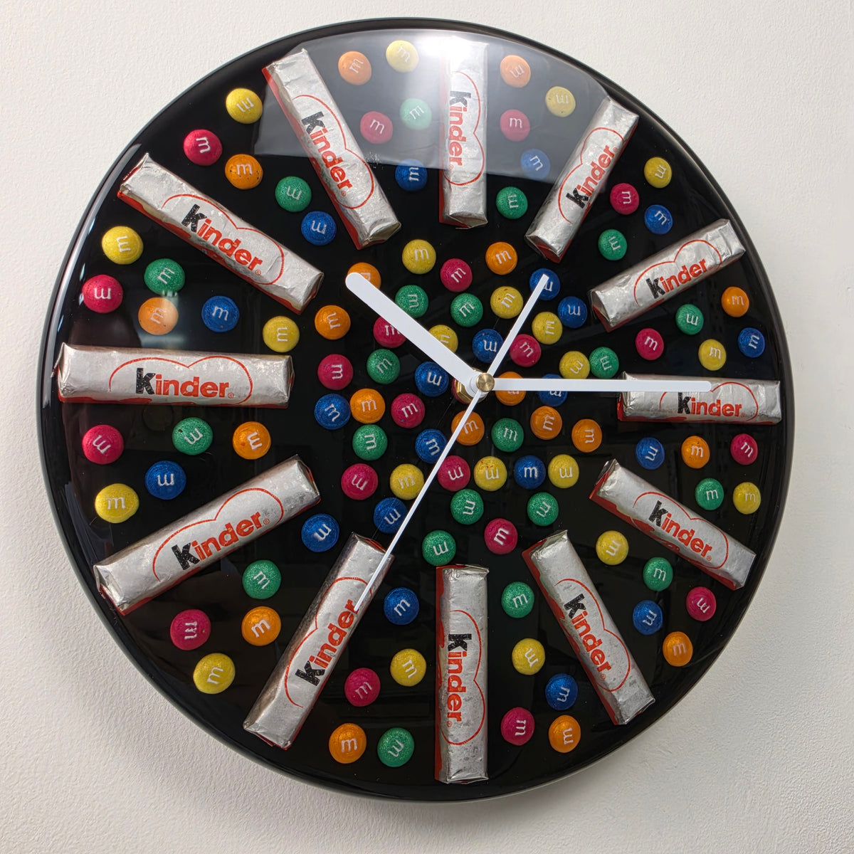 Handmade Sweet Time resin wall clock with colorful candy-inspired elements on a black background
