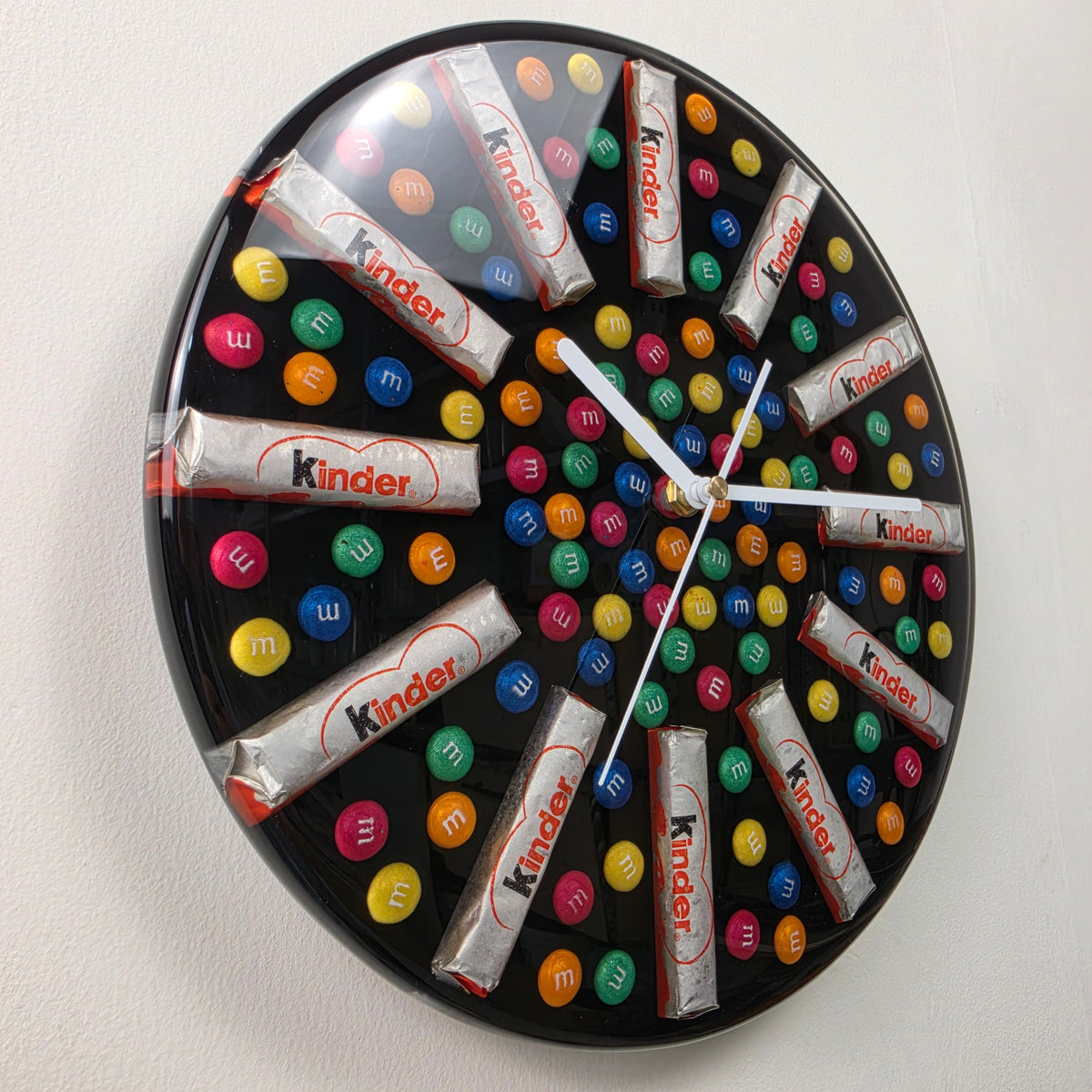 Round black resin wall clock featuring colorful handmade candy-inspired elements