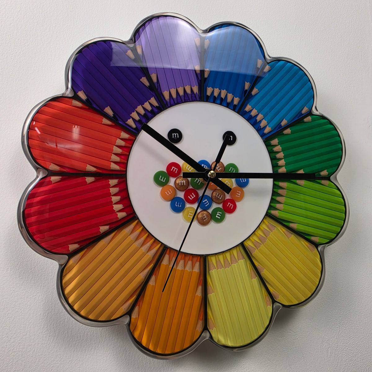 Rainbow Bloom handmade flower-shaped wall clock made with colorful pencils and clear epoxy resin.