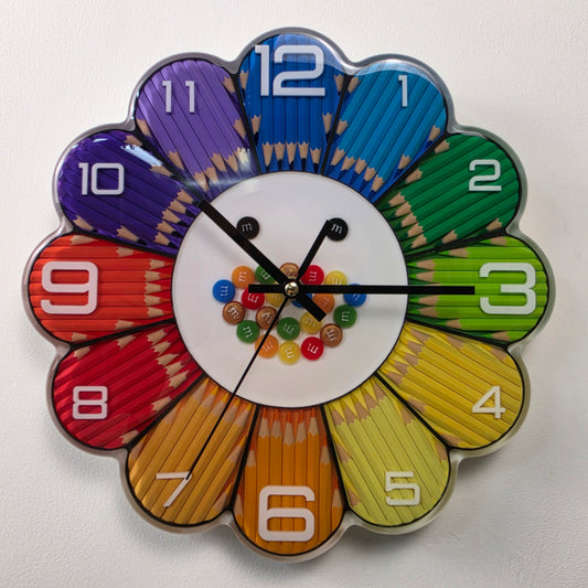 Rainbow Bloom Numbers handmade flower-shaped wall clock with colorful pencils, white numbers and glossy epoxy resin.