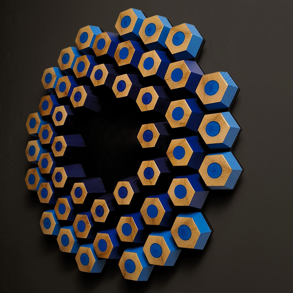 Blue contemporary wall relief with dimensional hexagon pattern and resin-filled geometric details