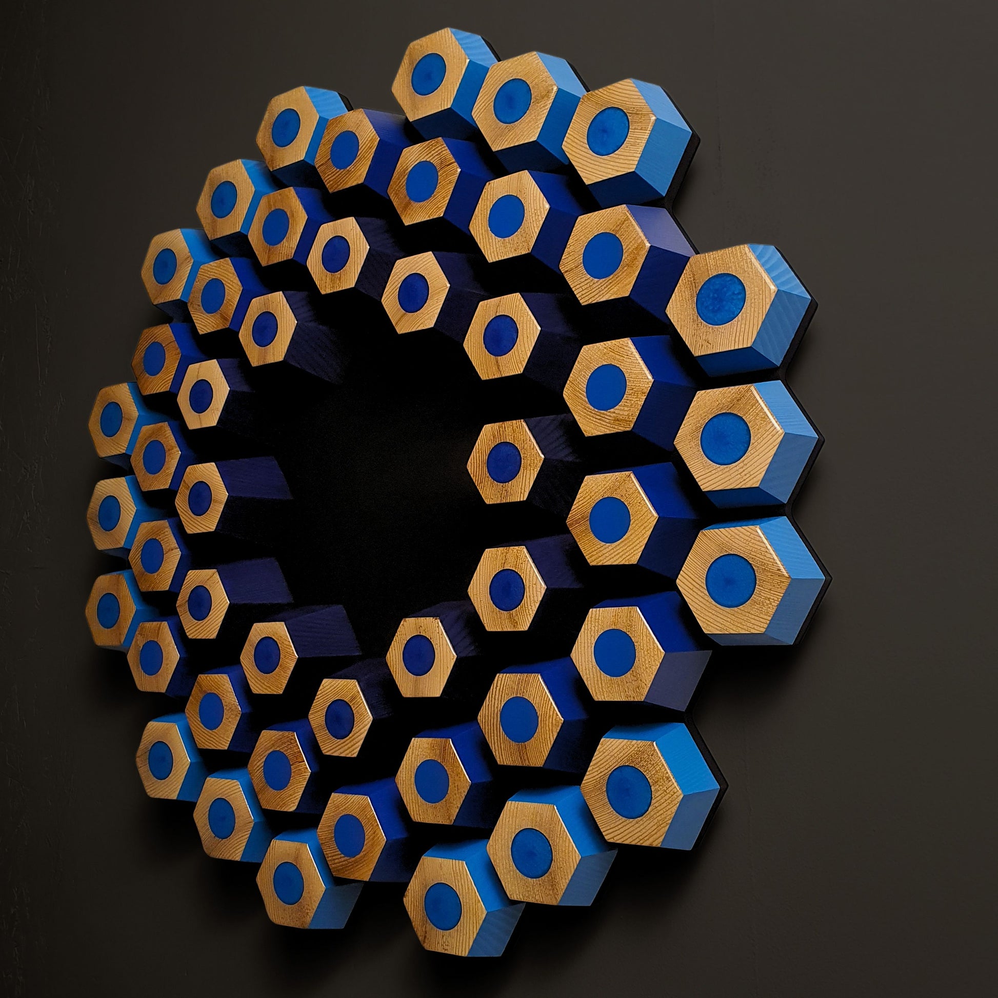 Blue contemporary wall relief with dimensional hexagon pattern and resin-filled geometric details