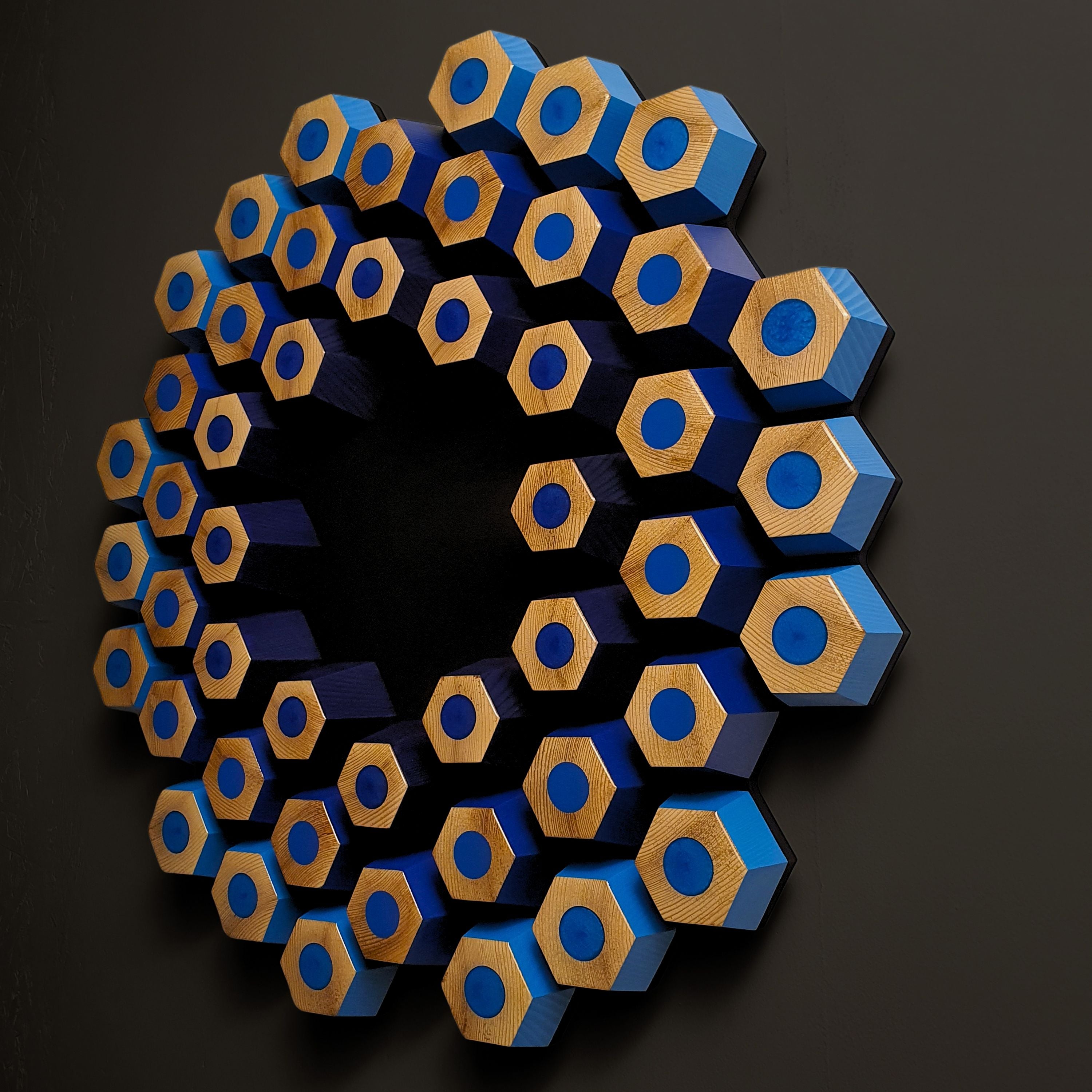 Blue contemporary wall relief with dimensional hexagon pattern and resin-filled geometric details