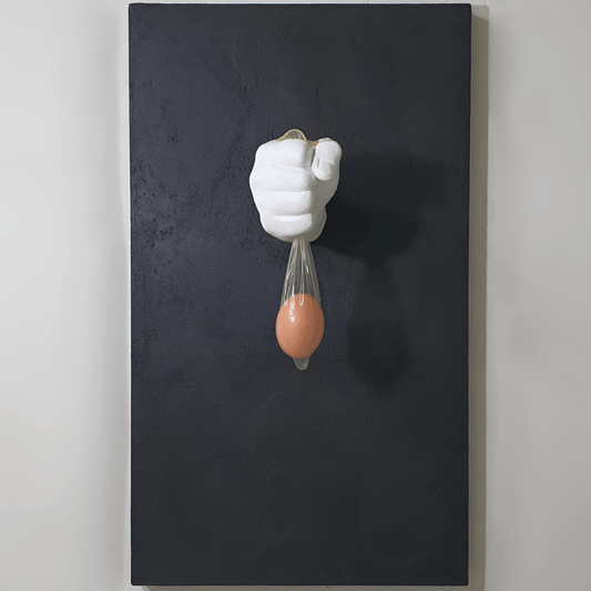 Vita Protetta conceptual artwork – plaster hand holding condom with wooden egg, symbolic installation, front view