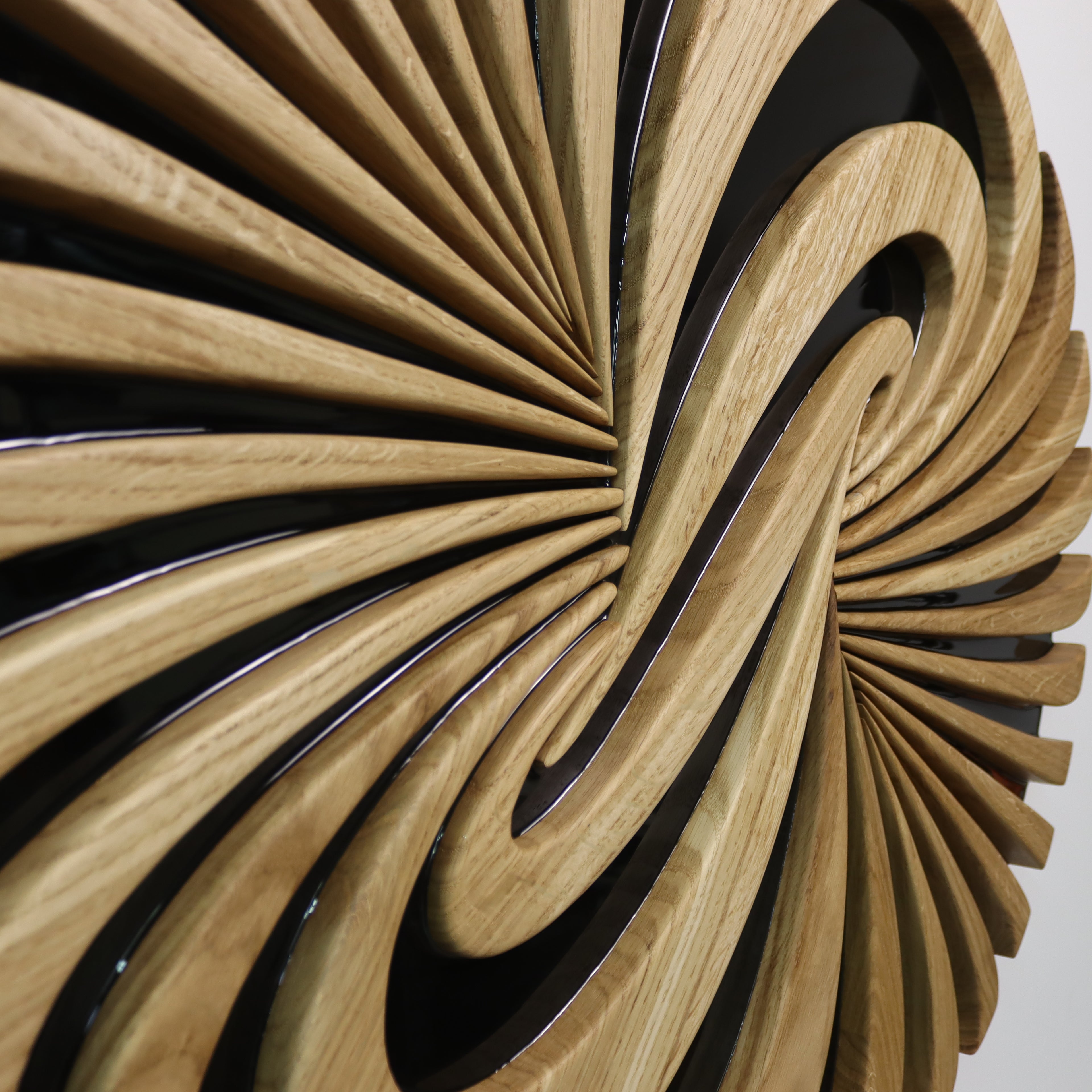 Side perspective of Vortice wall art highlighting 3D form and flowing lines