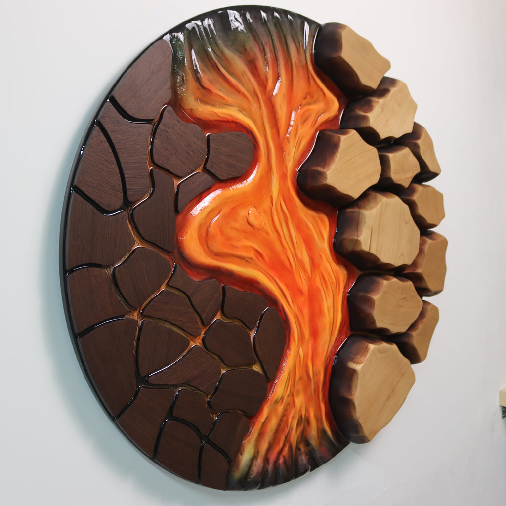 Contrast between dark wenge wood and bright resin flow