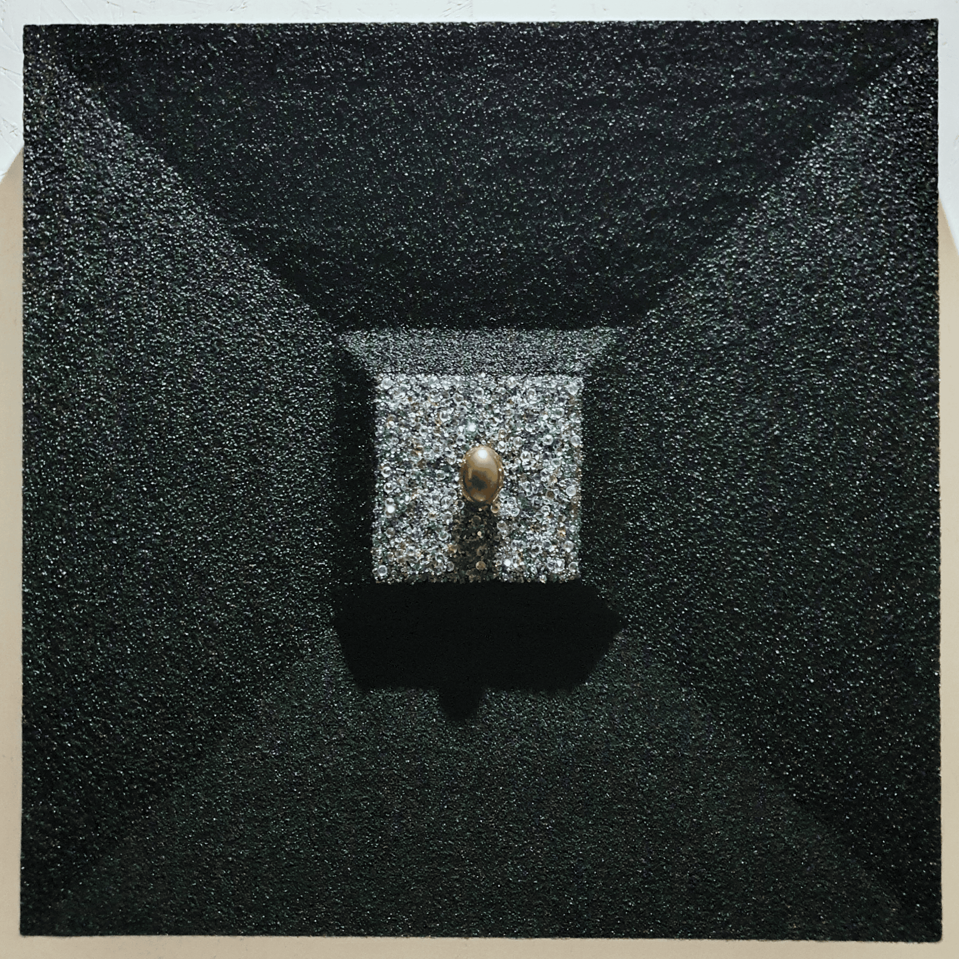 La Verità Nascosta conceptual artwork – golden egg emerging from block of crystals framed in dark structure, front view