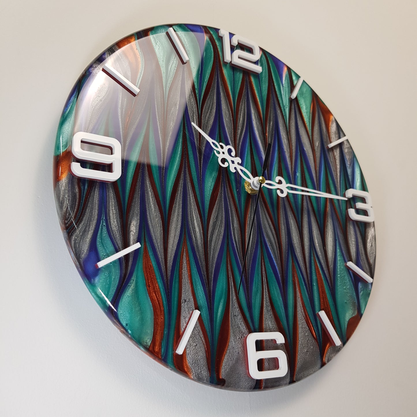 Left side perspective of the “Aurora Stream” epoxy resin wall clock – showing depth, texture, and reflective surface.