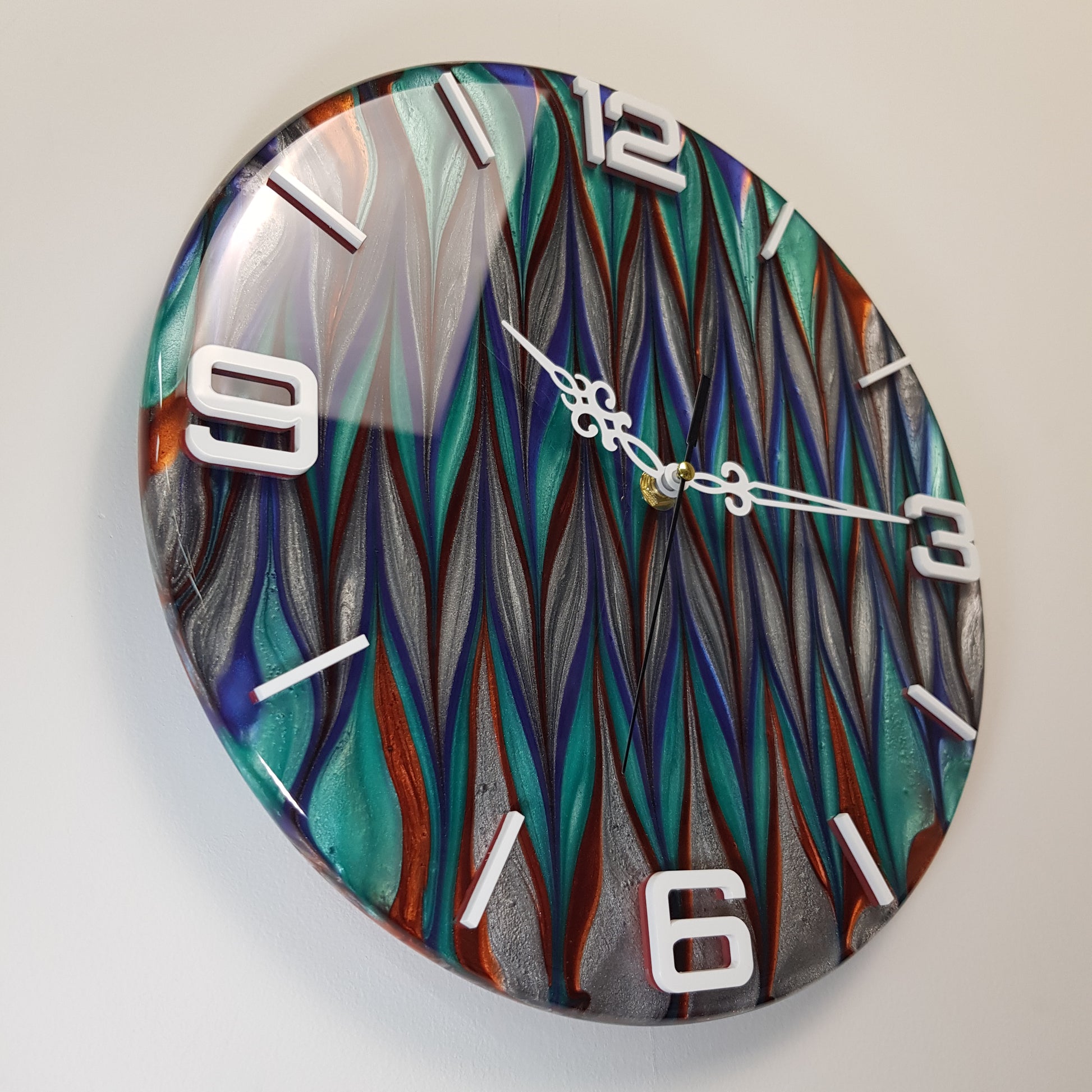 Left side perspective of the “Aurora Stream” epoxy resin wall clock – showing depth, texture, and reflective surface.