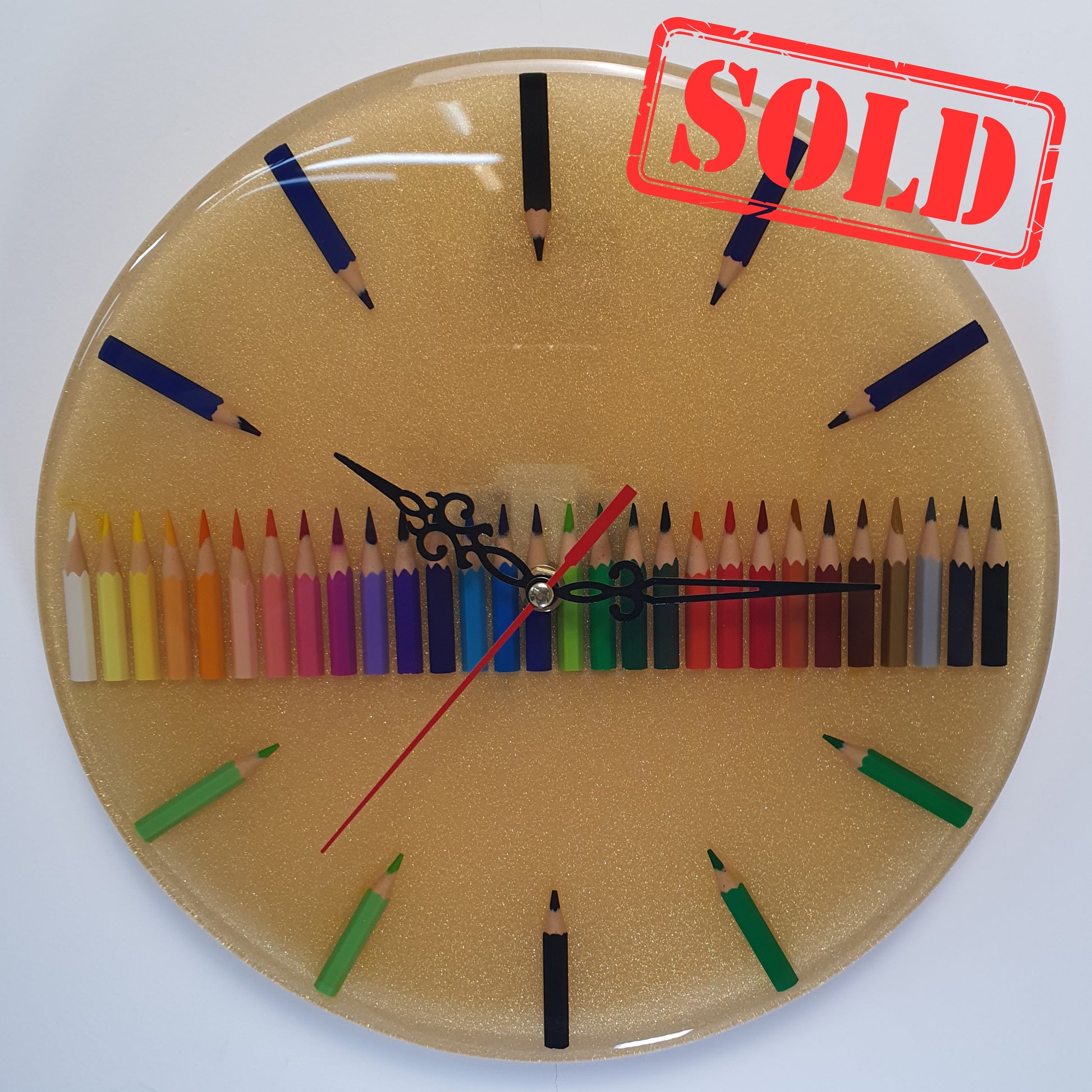 Color Time epoxy resin wall clock with colored pencils – full front view